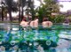 A group of naked women in a swimming pool.